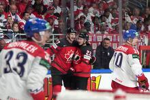 Jack Quinn and Tyler Myers of Canada celebrate a goal during the group B match between Canada and Czech Republic at the ice hockey world championship in Riga, Latvia, Tuesday, May 23, 2023. (AP Photo/Roman Koksarov)