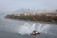 A New York City Fire Department (FDNY) fireboat sprays during the start of the New York City Marathon in New York City, U.S., November 6, 2022. REUTERS/Brendan McDermid