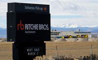 FILE PHOTO: The sign outside Richie Bros. Auctioneers is seen in Longmont, Colorado, U.S., February 21, 2017. REUTERS/Rick Wilking/File Photo