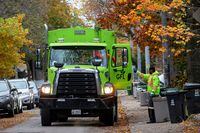 A truck from Canadian waste management company GFL Environmental Inc, which is planning an IPO, makes its rounds through a neighbourhood in Toronto, Ontario, Canada November 5, 2019. Picture taken November 5, 2019.  REUTERS/Carlos Osorio
