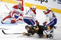 Joel Armia #40 of the Montreal Canadiens is called for a holding penalty on Zach Whitecloud #2 of the Vegas Golden Knights during the second period in Game Two of the Stanley Cup Semifinals during the 2021 Stanley Cup Playoffs at T-Mobile Arena on June 16, 2021 in Las Vegas, Nevada. (Photo by Sam Morris/Getty Images)