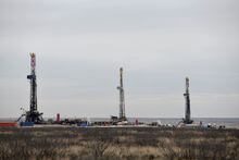 FILE PHOTO: Drilling rigs operate in the Permian Basin oil and natural gas production area in Lea County, New Mexico, U.S., February 10, 2019. Picture taken February 10, 2019. REUTERS/Nick Oxford