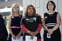 FILE - Amanda Zurawski, who developed sepsis and nearly died after being refused an abortion when her water broke at 18 weeks, left, and Samantha Casiano, who was forced to carry a nonviable pregnancy to term and give birth to a baby who died four hours after birth, center, stand with their attorney Molly Duane outside the Travis County Courthouse, Wednesday, July 19, 2023, in Austin, Texas. A Texas judge ruled Friday, Aug. 4, 2023, the state’s abortion ban has proven too restrictive for women with serious pregnancy complications and must allow exceptions without doctors fearing the threat of criminal charges. The challenge is believed to be the first in the U.S. brought by women who have been denied abortions since the Supreme Court last year overturned Roe v. Wade, which for nearly 50 years had affirmed the constitutional right to an abortion. (AP Photo/Eric Gay, File)