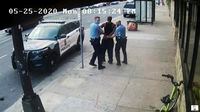 FILE - This image from video shows Minneapolis police Officers Thomas Lane, left and J. Alexander Kueng, right, escorting George Floyd, center, to a police vehicle outside Cup Foods in Minneapolis, on May 25, 2020. Three former Minneapolis officers headed to trial this week on federal civil rights charges in the death of George Floyd aren't as familiar to most people as Derek Chauvin, a fellow officer who was convicted of murder last spring. (Court TV via AP, Pool, File)