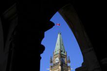 The Canada flag flies on top of the Peace Tower on Parliament Hill in Ottawa on March 6, 2023. A program that for five decades has had young Canadians shadow MPs from across the political spectrum is facing an uncertain future, as the model that has kept it running for five decades grates against modern labour codes and tax laws. THE CANADIAN PRESS/Sean Kilpatrick