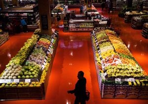 People shop in the produce area at a Loblaws store in Toronto on May 3, 2018.