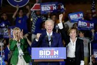 Democratic presidential candidate former Vice President Joe Biden speaks at a primary election night campaign rally Tuesday, March 3, 2020, in Los Angeles with his wife Jill Biden, left, and his sister Valerie. (AP Photo/Chris Carlson)