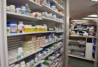 Shelves of medication are seen at a pharmacy in Quebec City, Thursday, March 8, 2012. A change affecting pharmaceuticals in the updated North American free trade agreement will mean cost savings for Canadians, but big drug companies say it could affect investment. THE CANADIAN PRESS/Jacques Boissinot
