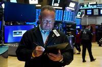 Trader Robert Arciero works on the floor of the New York Stock Exchange, Aug. 10, 2021.
