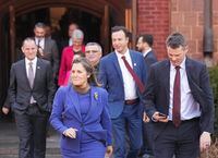 Chrystia Freeland, left, Canada's Deputy Prime Minister and Minister of Finance and Nate Horner, right, Alberta Finance Minister walk together as Freeland hosts the annual meeting of federal, provincial, and territorial finance ministers in Toronto on Friday, December 15, 2023. THE CANADIAN PRESS/Nathan Denette