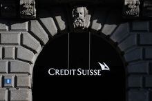 The sign and logo of Credit Suisse bank is seen at their headquarters in Zurich on March 20, 2023. - Swiss banking giant UBS agreed to take over Credit Suisse for $3 billion Swiss francs ($3.25 billion) in a government-brokered deal over the weekend following days of market upheaval over the health of the banking sector. (Photo by Fabrice COFFRINI / AFP) (Photo by FABRICE COFFRINI/AFP via Getty Images)