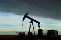 An oilfield pumpjack works on an oil well, belonging to Cenovus Energy, near Brooks, Alberta.    The Canadian Press Images/Larry MacDougal