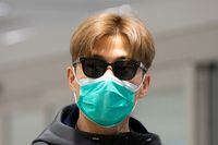 There is much that can be done now to prevent spread of the coronavirus as this traveller, wearing a mask at Pearson airport in Toronto on Sunday, knew very well.
