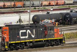 Canadian National Railway Co. is lowering its earnings forecast for the year on the heels of falling profits and revenue last quarter. CN rail trains are shown at the CN MacMillan Yard in Vaughan, Ont., on Monday, June 20, 2022. THE CANADIAN PRESS/Nathan Denette