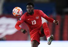 Canada midfielder Alphonso Davies (19) controls the ball against Honduras during first half CONCACAF Nations League soccer action in Toronto on Tuesday, March 28, 2023. THE CANADIAN PRESS/Nathan Denette