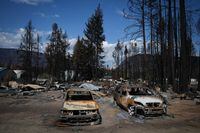 Burned vehicles are seen at a property destroyed by the Bush Creek East wildfire, in Scotch Creek, B.C., Wednesday, Sept. 6, 2023. THE CANADIAN PRESS/Darryl Dyck