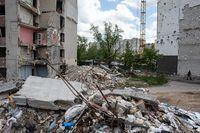 CHERNIHIV, UKRAINE - MAY 28: Piles of rubble are seen next to the heavily damaged apartment building on May 28, 2022 in Chernihiv, Ukraine. Chernihiv, northeast of Kyiv, was an early target of Russia's offensive after its Feb. 24 invasion. While they failed to capture the city, Russian forces battered large parts of Chernihiv and the surrounding region in their attempted advance toward the capital. (Photo by Alexey Furman/Getty Images)