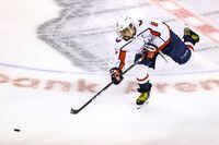 Alex Ovechkin of the Washington Capitals passes the puck against the New York Islanders during the Caps' 3-2 win on Aug. 18, 2020.