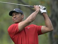 Tiger Woods watches his tee shot on the fourth hole during the final round of the PNC Championship golf tournament, Sunday, Dec. 20, 2020, in Orlando, Fla. (AP Photo/Phelan M. Ebenhack)