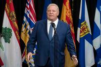 Ontario Premier Doug Ford speaks with media before making his way to a meeting on health care with the Prime Minister, Tuesday, February 7, 2023 in Ottawa.  THE CANADIAN PRESS/Adrian Wyld