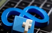 FILE PHOTO: A 3D printed Facebook's new rebrand logo Meta and Facebook logo are placed on laptop keyboard in this illustration taken on November 2, 2021. REUTERS/Dado Ruvic/Illustration/File Photo