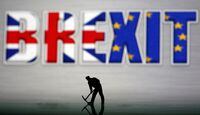 A small toy figure is seen in front of a Brexit logo in this illustration picture, March 30, 2019.