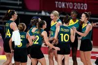 Australia players celebrate at the end of a women's basketball preliminary round game against Puerto Rico at the 2020 Summer Olympics, Monday, Aug. 2, 2021, in Saitama, Japan. (AP Photo/Charlie Neibergall)