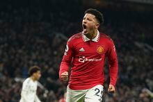 Manchester United's Jadon Sancho celebrates after scoring his sides second goal during the English Premier League soccer match between Manchester United and Leeds United at Old Trafford in Manchester, England, Wednesday, Feb. 8, 2023. (AP Photo/Dave Thompson)