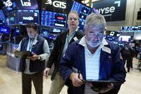 A trio of traders work on the floor of the New York Stock Exchange, Friday, Aug. 25, 2023. (AP Photo/Richard Drew)
