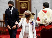 Governor General Julie Payette leaves with Prime Minister Justin Trudeau after the throne speech in the Senate chamber in Ottawa, on Sept. 23, 2020.