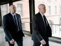 FILE - Former Minneapolis police officer J. Alexander Kueng, left, and his attorney Thomas Plunkett arrive for sentencing for violating George Floyd's civil rights outside the Federal Courthouse Wednesday, July 27, 2022 in St. Paul, Minn. A judge has scheduled a hearing for Monday, Aug. 15, 2022, on the status of plea negotiations in the case of the two remaining officers awaiting trial on state charges in the murder of George Floyd. Tou Thao and Kueng face a late October trial. (David Joles/Star Tribune via AP, File)