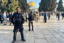 Israeli security forces stand guard as Jews tour Jerusalem's al-Aqsa mosque compound on April 5, 2023 as the Jewish Passover coincides with the Muslim holy month of Ramadan. - Israeli police in riot gear stormed the mosque's prayer hall before dawn, with the goal of dislodging "law-breaking youths and masked agitators" who they said had barricaded themselves inside following evening prayers. (Photo by AHMAD GHARABLI / AFP) (Photo by AHMAD GHARABLI/AFP via Getty Images)