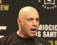 FILE - Joe Rogan is seen during a weigh-in before UFC 211 on Friday, May 12, 2017, in Dallas before UFC 211. Spotify’s popular U.S. podcaster has apologized after a video compilation surfaced that showed him using racial slurs in clips of episodes over a 12-year span. In a video posted on his Instagram account on Saturday, Feb. 5, 2022, Rogan who hosts a podcast called “The Joe Rogan Experience,” said his use of the slurs was the “most regretful and shameful thing that I’ve ever had to talk about publicly.” ( AP Photo/Gregory Payan, File)