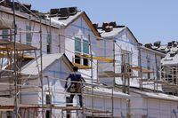 FILE PHOTO: Residential single family homes construction by KB Home are shown under construction in the community of Valley Center, California, U.S. June 3, 2021. REUTERS/Mike Blake/File Photo