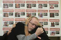 Orit Meir, right, mother of Israel hostage Almog Meir is comforted by Thomas Hand, left, father of 9 year old Irish-Israeli hostage Emily Hand, both taken after the Oct. 7 assault by Hamas militants, attend a news conference at the Israel Embassy in London, Monday, Nov. 20, 2023. More than 200 Israelis and foreigners were taken hostage on Oct. 7 after Hamas militants infiltrated Israel. (AP Photo/Kin Cheung)