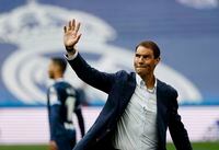 Soccer Football - LaLiga - Real Madrid v Espanyol - Santiago Bernabeu, Madrid, Spain - April 30, 2022 Spain's Rafael Nadal waves to supporters after completing the honorary kick off before the match REUTERS/Susana Vera