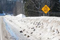 An end slide area sign just before the Cottonwood River on Highway 97 South is shown just outside of Quesnel, B.C., on Thursday, March 9, 2023. THE CANADIAN PRESS/James Doyle