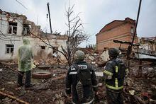 Rescuers are seen at the site of a building of local museum heavily damaged by a Russian missile strike, amid Russia's attack on Ukraine, in the town of Kupiansk, Kharkiv region, Ukraine April 25, 2023.  REUTERS/Viktoriia Yakymenko
