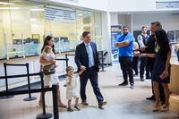 Brampton Mayor Patrick Brown walks with his family as he files paperwork before announcing his intention to re-run for mayorship, at city hall in Brampton, Ont., on Monday, July 18, 2022. THE CANADIAN PRESS/Cole Burston