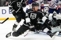 Los Angeles Kings' Quinton Byfield (55) defenses against the Edmonton Oilers during the third period of an NHL hockey game Monday, Jan. 9, 2023, in Los Angeles. The Kings won 6-3. (AP Photo/Jae C. Hong)