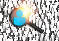 Searching for the best job candidate and people finder concept looking for the right person to stand out from the crowd.  Top pick and best choice for fitting the skillset that HR is looking for.