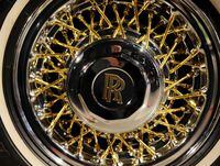A gold-plated wire wheel and logo are seen on the Rolls Royce Silver Spirit ?Kroko? cabriolet during the "Garage" exhibition, in the Riga Motor Museum, in Riga, Latvia February 22, 2020. REUTERS/Ints Kalnins/Files