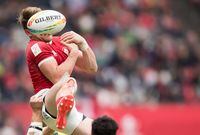 Canada's Theo Sauder, front, bobbles the ball while vying for it against Australia's Nick Malouf during a semifinal match at the Canada Sevens rugby tournament in Vancouver on Sunday, March 8, 2020. THE CANADIAN PRESS/Darryl Dyck