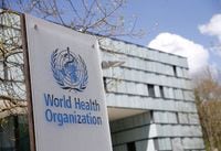 FILE PHOTO: A logo is pictured outside a building of the World Health Organization (WHO) during an executive board meeting on update on the coronavirus disease (COVID-19) outbreak, in Geneva, Switzerland, April 6, 2021. REUTERS/Denis Balibouse