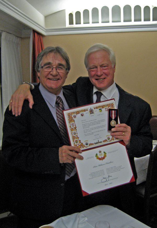 Senator Charlie Watt (left) presenting Peter W. Hutchins (right) with the Queen Elizabeth II Diamond Jubilee Medal in 2012