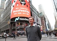 Founder and CEO of BuzzFeed Jonah H. Peretti poses in front of BuzzFeed screen on Times Square during BuzzFeed Inc.'s Listing Day at Nasdaq on Dec. 6.