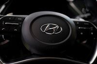 FILE PHOTO: The logo of Hyundai Motors is seen on a steering wheel of a all-new Sonata sedan on display at the company's headquarters in Seoul, South Korea, March 22, 2019.  REUTERS/Kim Hong-Ji/File Photo