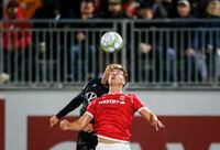 Pacific FC's Jordan Haynes, left, battles for the ball with Cavalry FC's Daan Klomp during second half soccer action in the Canadian Championship quarterfinal in Calgary, Alta., Wednesday, Sept. 22, 2021.THE CANADIAN PRESS/Jeff McIntosh