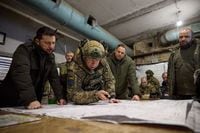 This handout photograph taken and released by the Ukrainian Presidential Press Service on November 30, 2023 shows Ukrainian President Volodymyr Zelensky (L), Colonel General Oleksandr Syrskyi (C) and Minister of Defence of Ukraine Rustem Umerov (R) visiting Ukraine's army command post in Kupiansk, Kharkiv region. (Photo by Handout / UKRAINIAN PRESIDENTIAL PRESS SERVICE / AFP) / RESTRICTED TO EDITORIAL USE - MANDATORY CREDIT "AFP PHOTO / UKRAINIAN PRESIDENTIAL PRESS SERVICE" - NO MARKETING NO ADVERTISING CAMPAIGNS - DISTRIBUTED AS A SERVICE TO CLIENTS (Photo by HANDOUT/UKRAINIAN PRESIDENTIAL PRESS SERVICE/AFP via Getty Images)