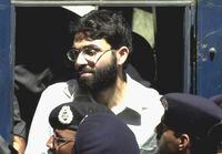 Ahmed Omar Saeed Sheikh arrives at a court in Karachi, Pakistan, on March 29, 2002.